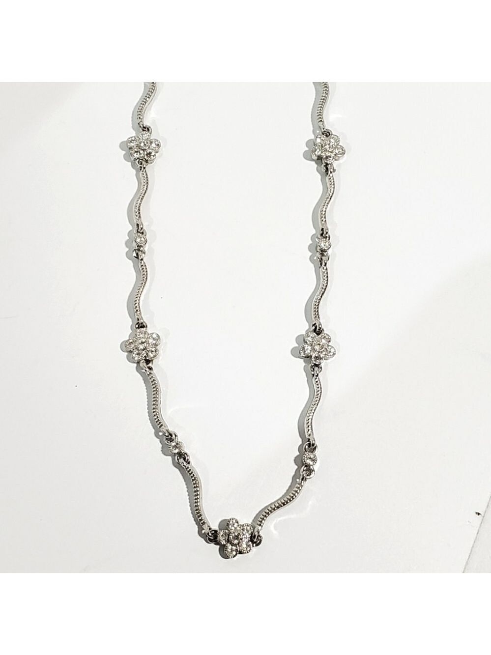 Vtg S.P signed (Avon?) Silvertone floral and wave Rhinestone necklace 18"